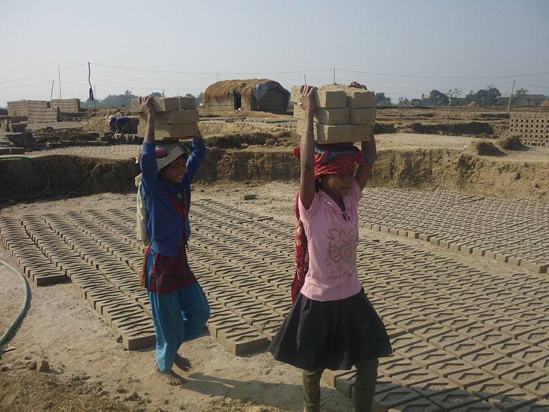 Girls working in a brick factory.