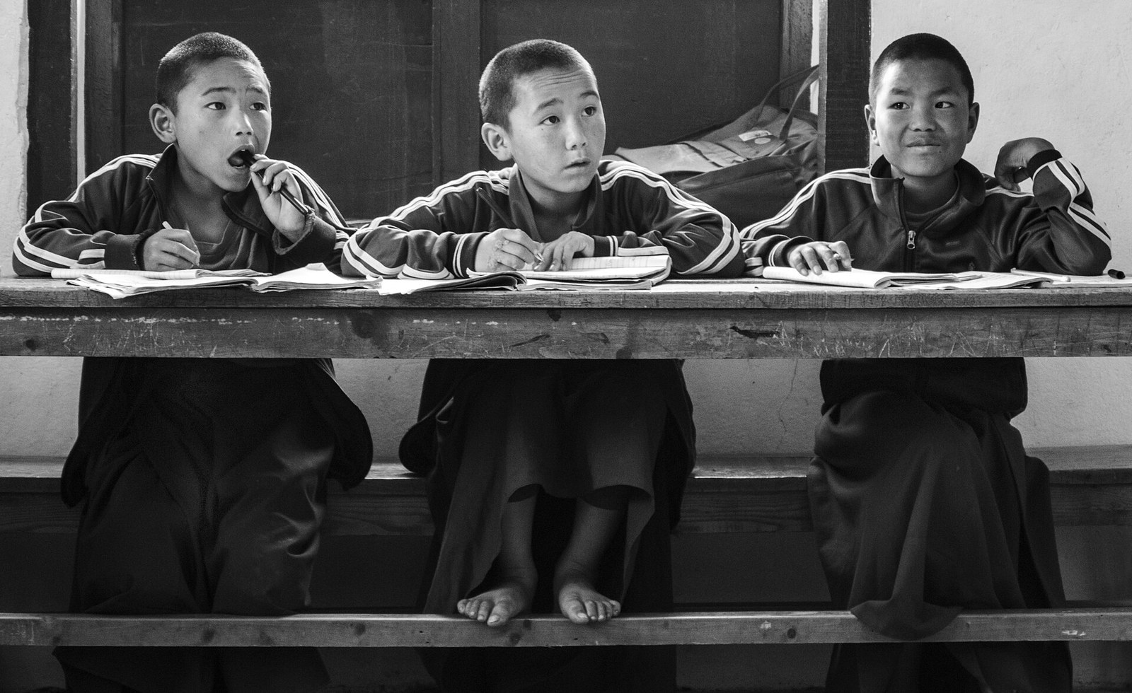 Students doing written work in a classroom in Nepal.